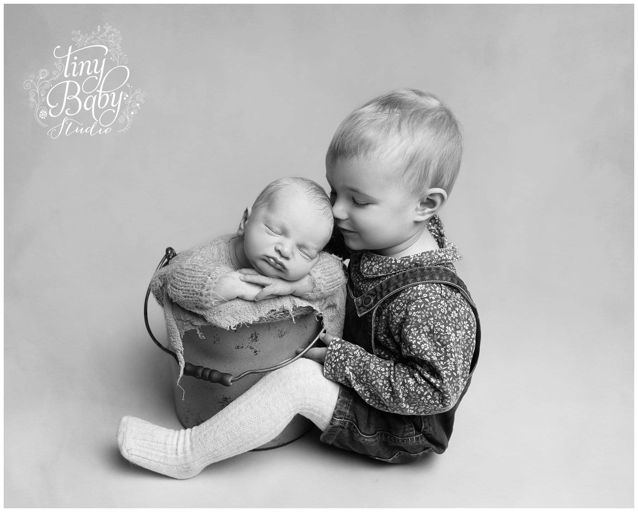 Older Sibling with Newborn at Tiny Baby Studio